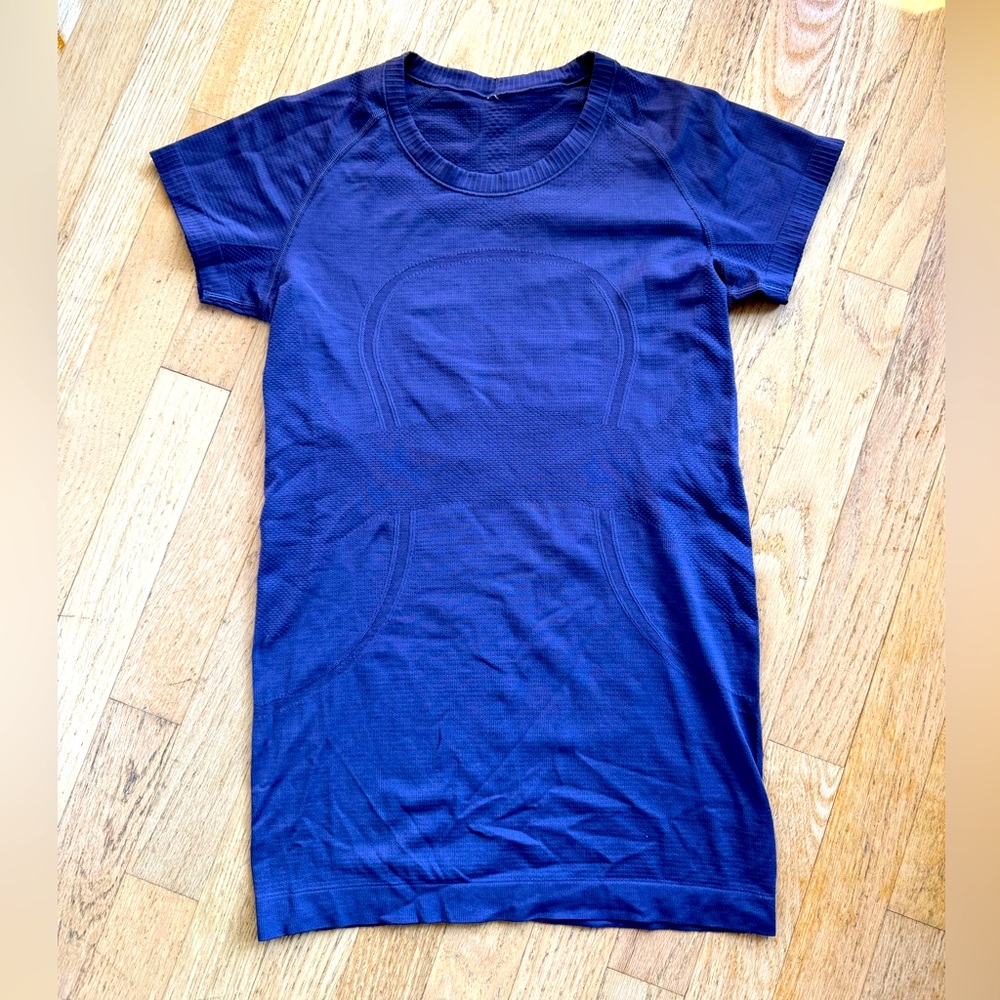 Purple swiftly tech women’s short-sleeve shirt.